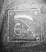 Load image into Gallery viewer, A clear square glass coaster etched with a set of pan pipes with an arched bottom. Underneath the bottom as the words &quot;The Eolian&quot;. 
