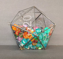 Load image into Gallery viewer, A glass and metal D20 die, half-full with multi-colored dice. There are 222 dice in the terrarium.