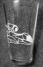 Load image into Gallery viewer, A pint glass etched with the Serentiy ship from Firefly. The ship is angled downward and wraps around the glass.