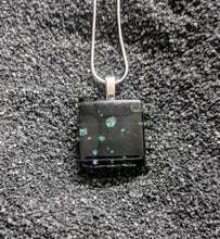 Load image into Gallery viewer, A square pendant made of glass. The design is black glass with small clusters of glitter sprinkled throughout.