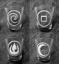 Load image into Gallery viewer, A collage of 4 extra extra large shot glasses, each one with a different Avatar Last Airbender nation represented in white.
