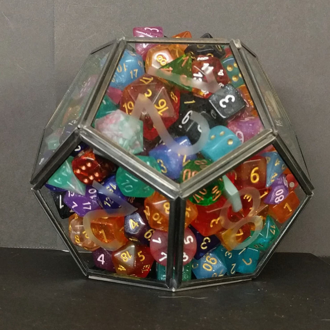 A small D12 terrarium completely full of dice in a mix of colors. There are 222 dice in the terrarium.