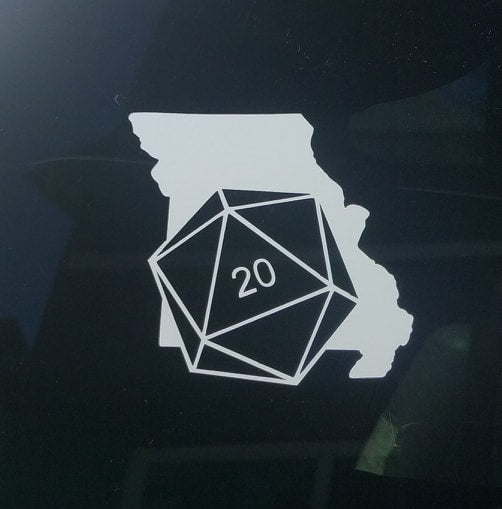 White car decal on the state of Missouri with a D20 die superimposed at an angle. 