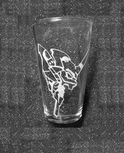 Load image into Gallery viewer, A pint glass etched with the head of Unit 01. It is looking to the right and its mouth is open. 

