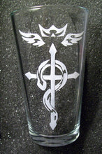 Load image into Gallery viewer, A pint glass etched with a tattoo-style version of the Flamel insignia from FMA. 
