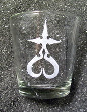 Load image into Gallery viewer, An extra large shot glass etched with a Nobody symbol- a cross, where the bottom &quot;leg&quot; is an upside down heart.
