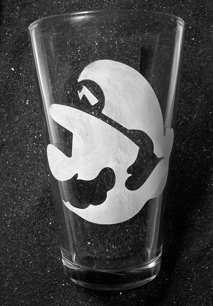A pint glass etched with Mario's face.