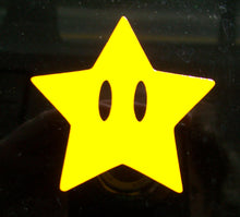 Load image into Gallery viewer, A yellow car decal of an invincibility star. 
