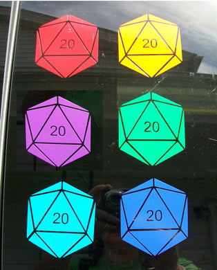 Six different colors of D20 decals on a car window. Each shape has the 20 face numbered but the other faces are blank. 